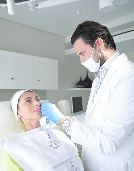 The doctor is improving the appearance of the patient’s tear troughs