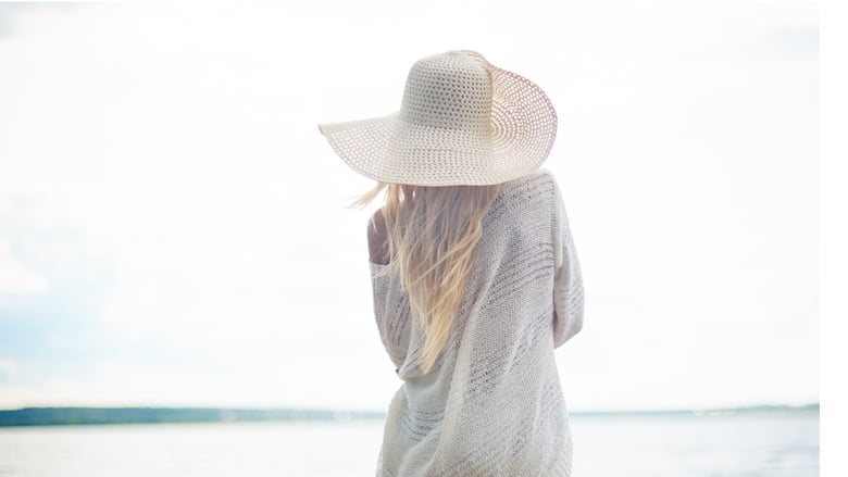 Enjoying sun and beach after breast augmentation surgery - with patience and proper following the post-recovery protocol, you can quickly go swimming again. 